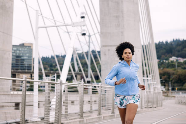 istock Woman Enjoying Run on Urban Bridge 1425650075