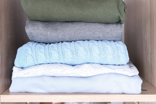 istock A stack of organized clothes on a shelf in a wardrobe 1425651403
