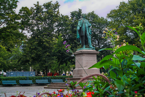 Oslo, Norway - August, 2019: Statue Of Henrik Wergeland, a writer and poet who's seen as a leader in Norway's literary heritage and modern Norwegian culture. He loved from 1808 'till 1845. The statue is in Eidsvolls plass and was made  by Brynjulf Bergslien in 1881.