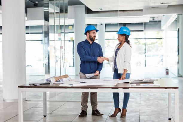 istock Handshake, architect and building engineer deal for designer collaboration after partnership meeting or planning architecture. Real estate construction teamwork or thank you for man and woman success 1425656845