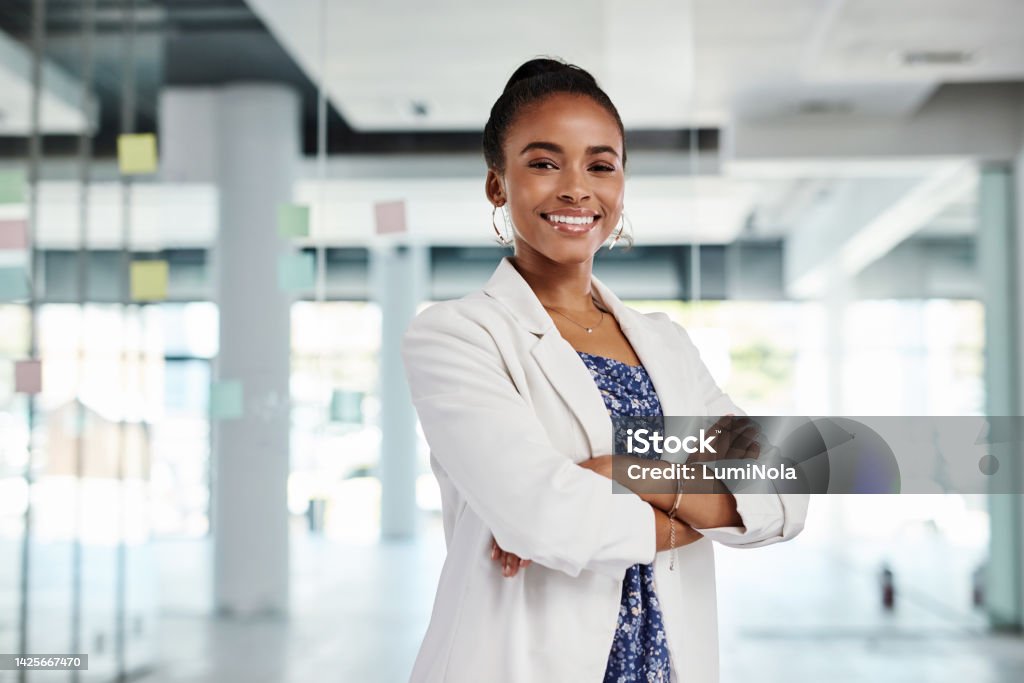 Portrait of a happy business black woman, leader and manager at end of strategy session portrait. Advertising company worker with a smile after conclusion of planning with sticky notes on glass wall Businesswoman Stock Photo
