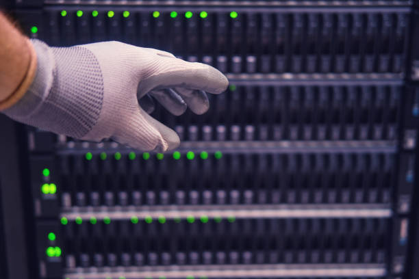 istock The hand of a male engineer at a data storage server, close-up 1425670183