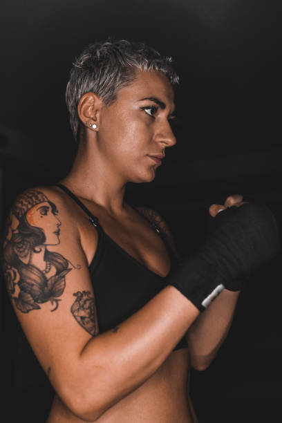 istock Determined young female kick boxer in the gym 1425675131