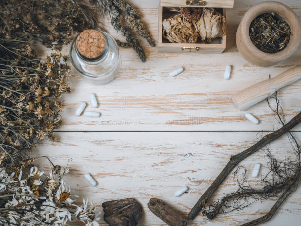 istock Dried flowers, jar, chest, mortar, roots and pills. 1425688462
