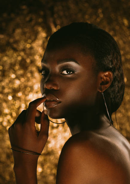 istock Beautiful young African woman with bright make up 1425695083