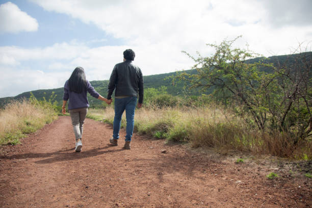 istock young couple in the countryside 1425698378