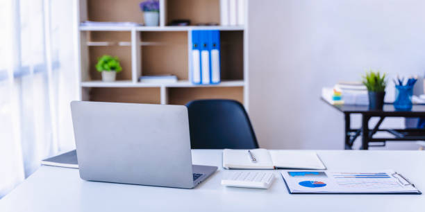 istock Laptop on desk with blur background. Workspace, office room concept 1425699693