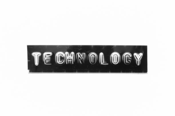 istock Embossed letter with word technology in black banner on white paper background 1425709058