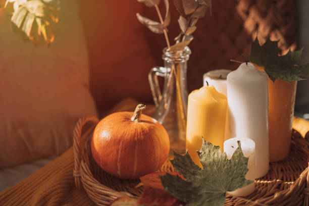 istock Autumn interior with burning candles and pumpkin 1425712224
