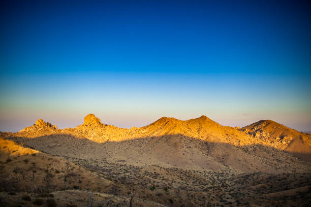 Aris landscape in the Mojave National Preserve in California. The preserve was established to protect nature and local animal species. This image is part of a series of views taken at different times of day from the same location; a time lapse is also available.