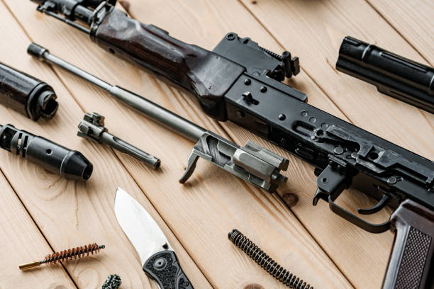 istock Disassembled rifle with cleaning tools on table of weapons workshop 1425720404