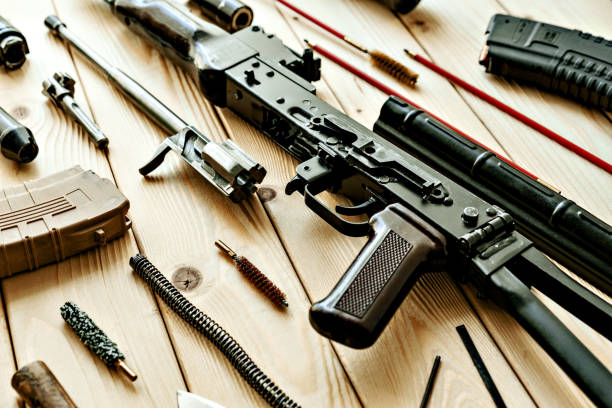 istock Disassembled rifle with cleaning tools on table of weapons workshop 1425720434