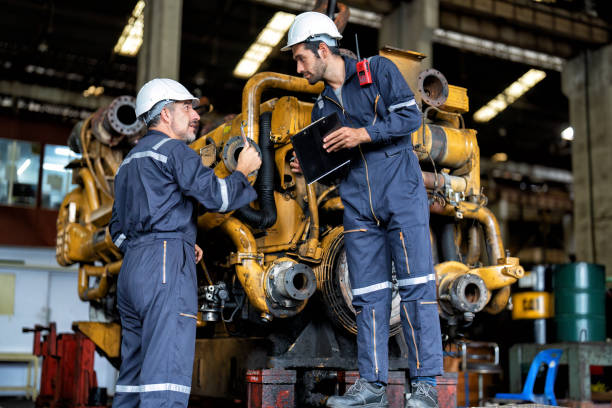 istock maintenance manager meet engineer checking and agreement hand check and sign on work schedule 1425722062