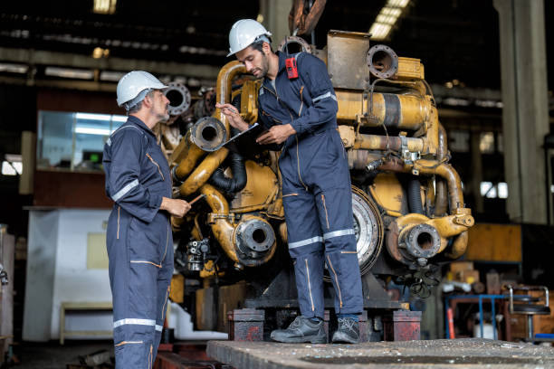 istock maintenance manager meet engineer checking and agreement hand check and sign on work schedule 1425722103