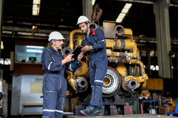 istock maintenance manager meet engineer checking and agreement hand check and sign on work schedule 1425722104