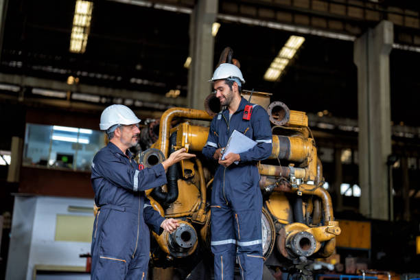 istock maintenance manager meet engineer checking and agreement hand check and sign on work schedule 1425722111