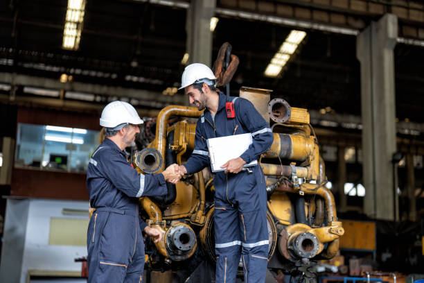 istock maintenance manager meet engineer checking and agreement hand check and sign on work schedule 1425722120