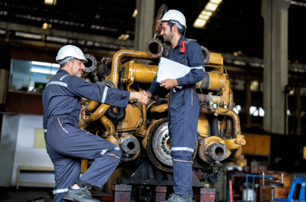 istock maintenance manager meet engineer checking and agreement hand check and sign on work schedule 1425722123
