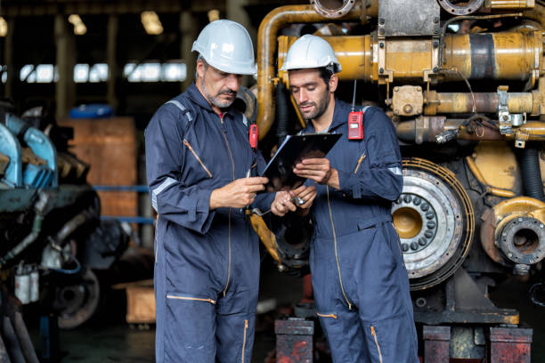 maintenance manager meet engineer checking and agreement hand check and sign on work schedule - turbo diesel imagens e fotografias de stock