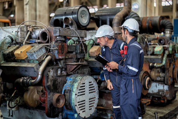 istock maintenance manager meet engineer checking and agreement hand check and sign on work schedule 1425722159