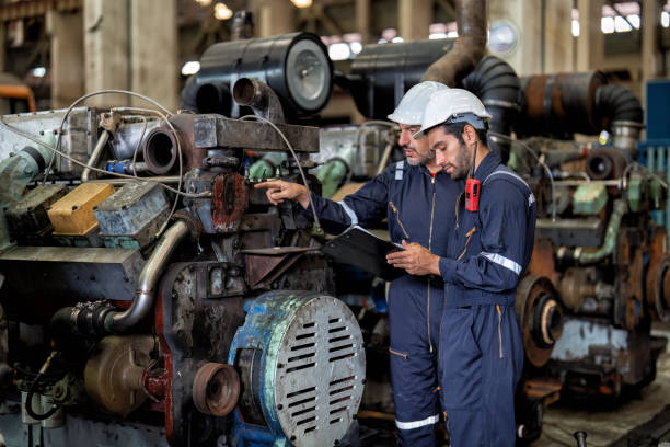istock maintenance manager meet engineer checking and agreement hand check and sign on work schedule 1425722170