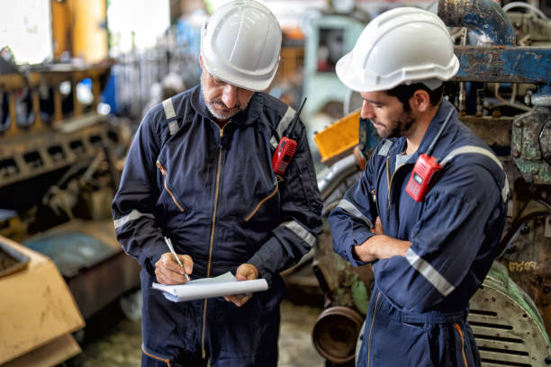 istock maintenance manager meet engineer checking and agreement hand check and sign on work schedule 1425722186