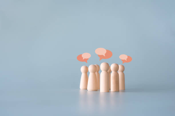 istock Group of wooden human figures communication connecting concept 1425725285