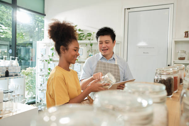 istock A shopkeeper and customer in refill store, zero-waste, and plastic-free grocery. 1425725871