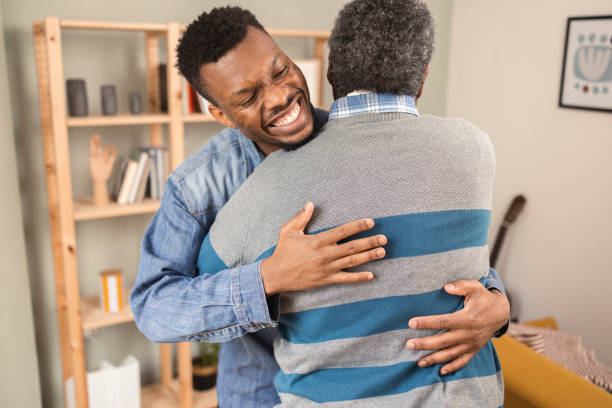 istock Young African American hugging his old father 1425726049