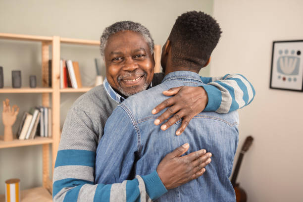 istock Young African American hugging his old father 1425726060