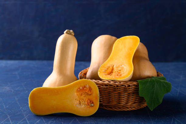 istock Butternut squash or butternut pumpkin on blue background 1425728296