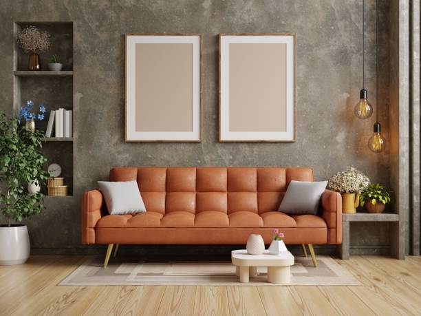 istock Living room have orange leather sofa and poster frame mock up on concrete wall. 1425734662
