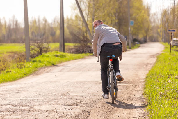 istock A guy riding a bike on rural roads 1425741579