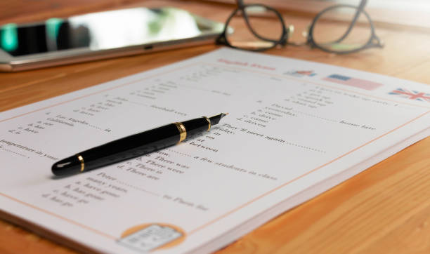 istock English test with pen on wooden table in class 1425743439