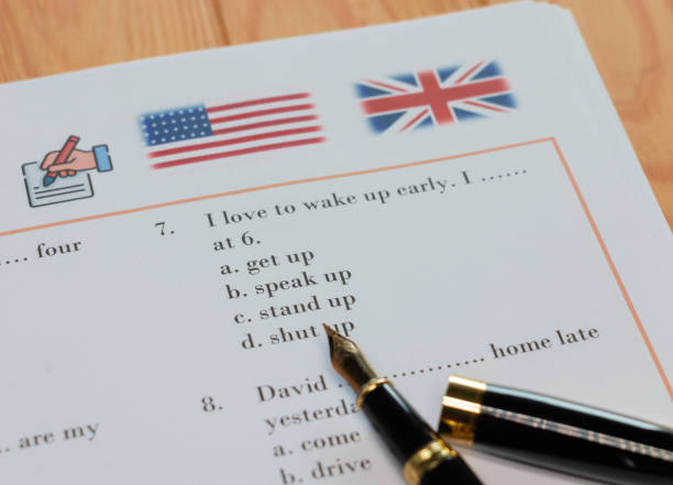 English test with pen on wooden table in class English test with pen on wooden table in class for school testing concept misspelled stock pictures, royalty-free photos & images