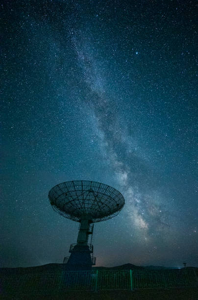 Radio telescope at night stock photo