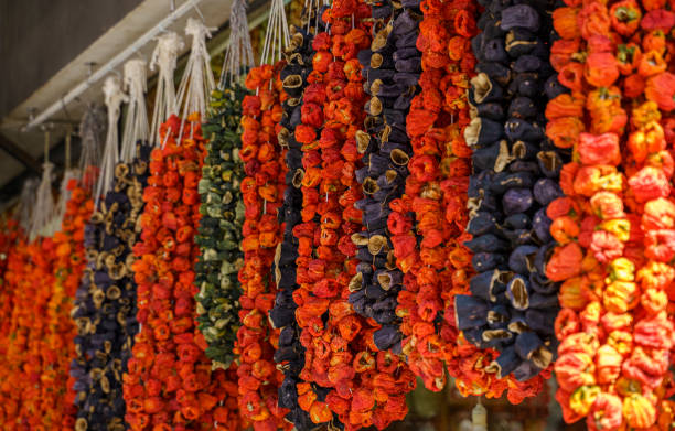 Dried peppers and eggplants hanging in a bazaar market in Gaziantep, Turkey stock photo