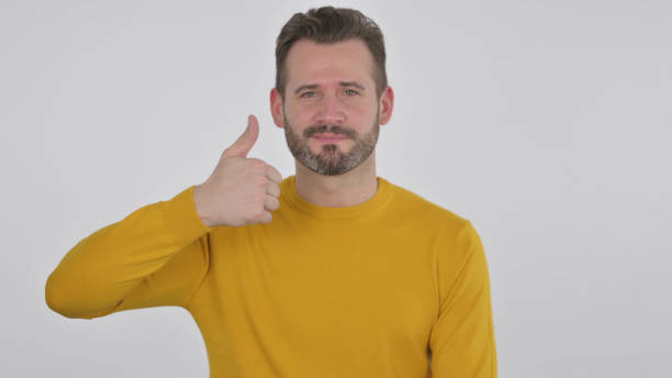 istock Middle Aged Man showing Thumbs Up Sign , White Background 1425750094