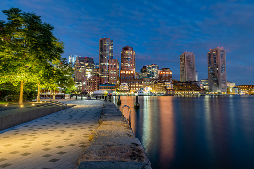 Panoramic view of Boston cityscape at Fan Pier Park \nat night, USA
