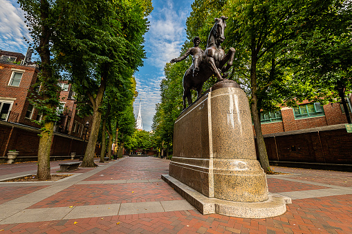Paul Revere Statue Old North Church Freedom Trail Boston Massachusetts. Church in 1775  put up lanterns to warn Paul Revere before Battle of Lexington. Statue installed in 1940 by Cyrus Dallin, who died 1944