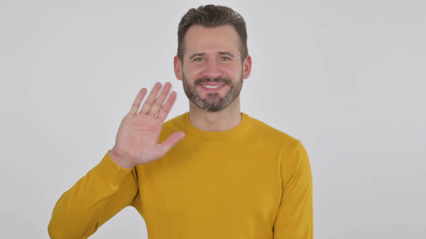 istock Middle Aged Man Waving, Welcoming, White Background 1425753869
