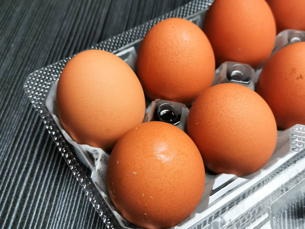 istock Top view image of raw chicken eggs in plastic tray with copy space. 1425766364