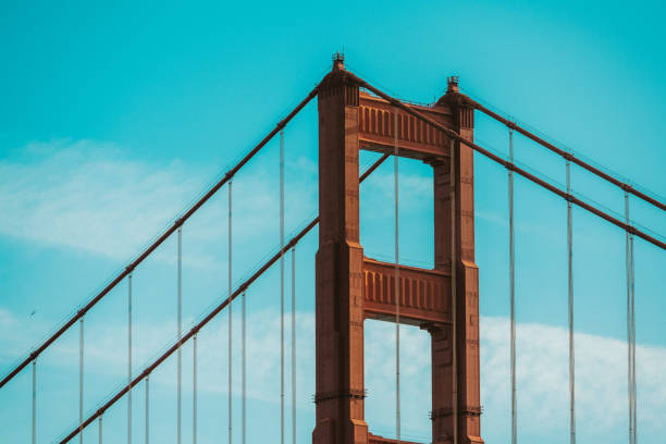 The Golden Gate Bridge structure seen in San Francisco, California, USA. Blue sky background.