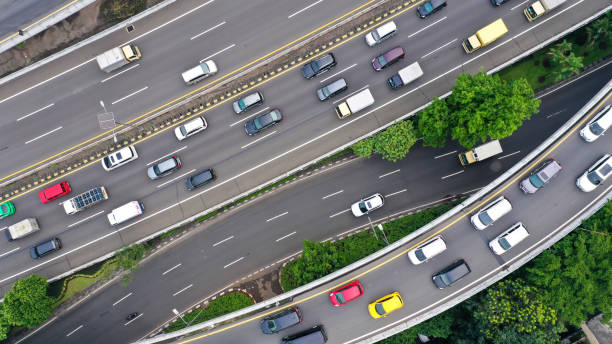 Aerial top down view on massive multi-level interchange on Jakarta city on a sunny summer day with light traffic