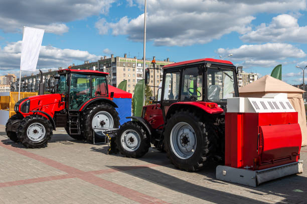 istock Two red wheeled tractors at an agricultural fair 1425780077