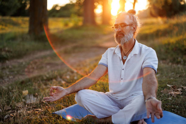 istock Mature man meditating in nature 1425781017