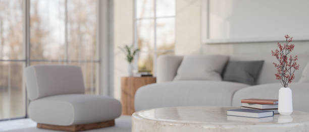 istock Modern marble coffee table with copy space against blurred minimal and comfortable living room 1425785765