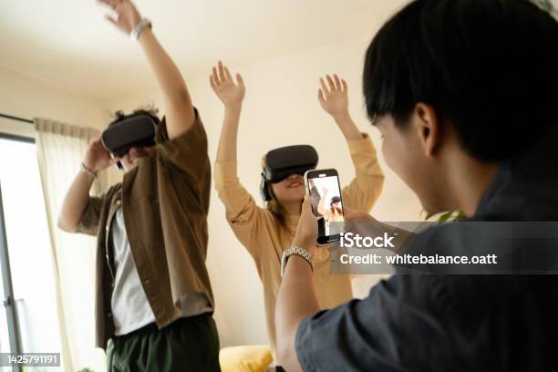 Friends Dance Using Vr To Add Fun Stock Photo - Download Image Now - 20-24 Years, Adolescence, Arts Culture and Entertainment