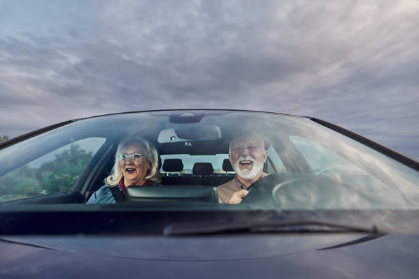 istock Happy mature couple going on a road trip by car. 1425791695