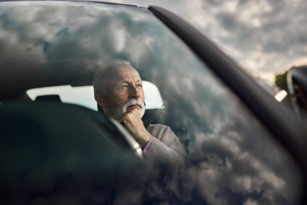 istock Thoughtful senior man in a car. 1425792359